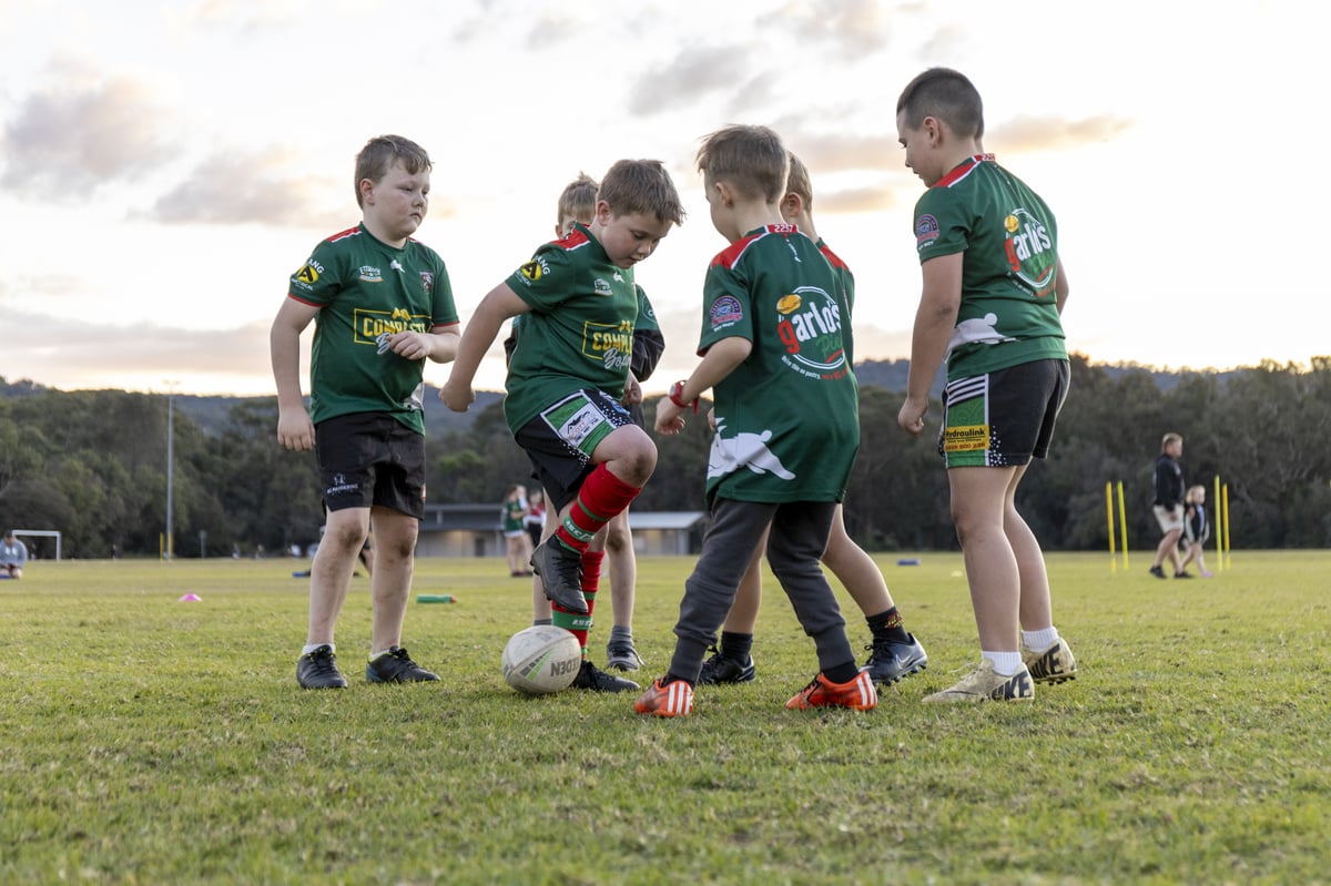 small boys playing rugby